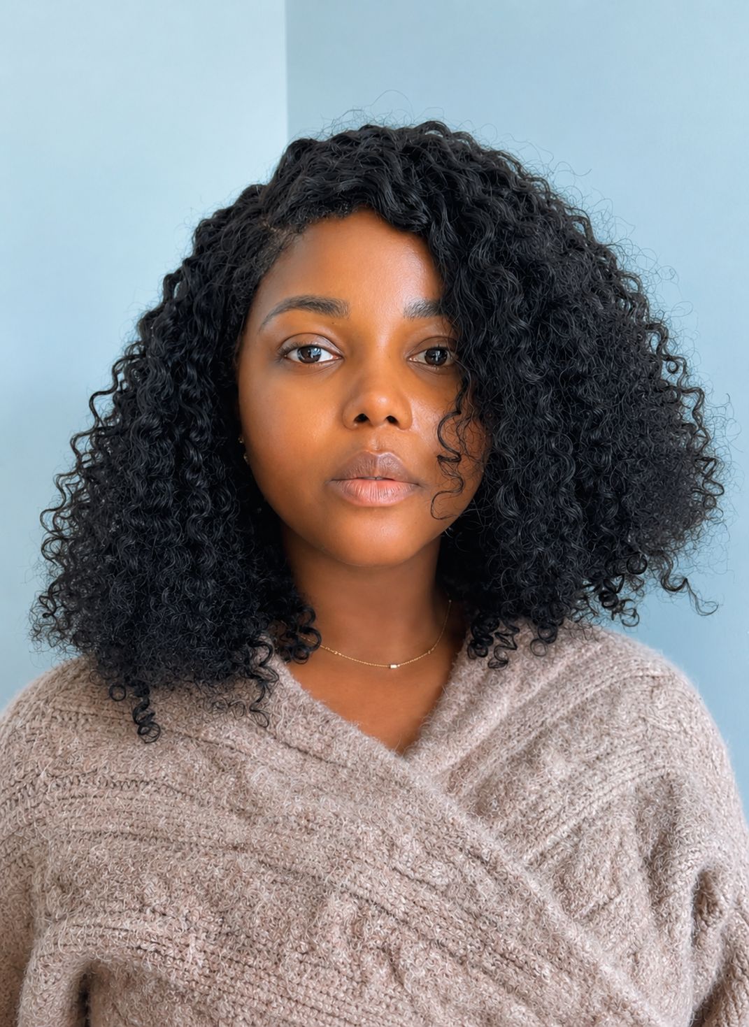 Woman with curly hair wearing hair